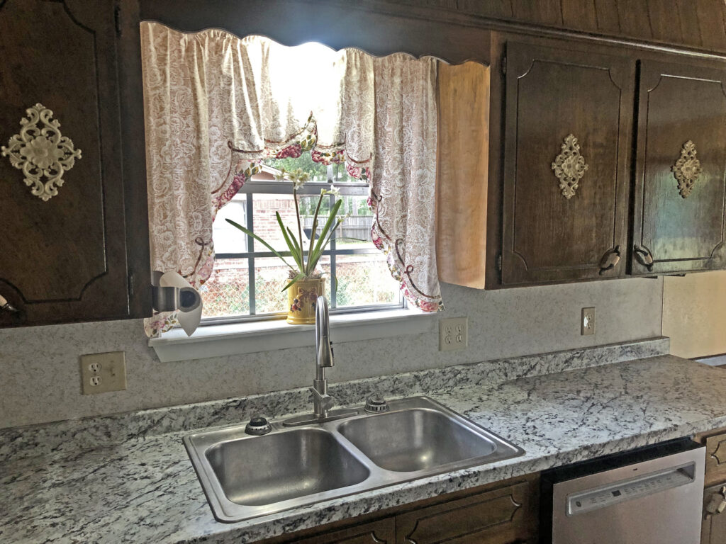 Window over kitchen sink. Perfect space for plants.
